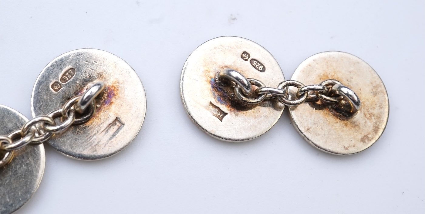 A collection of cufflinks and dress studs